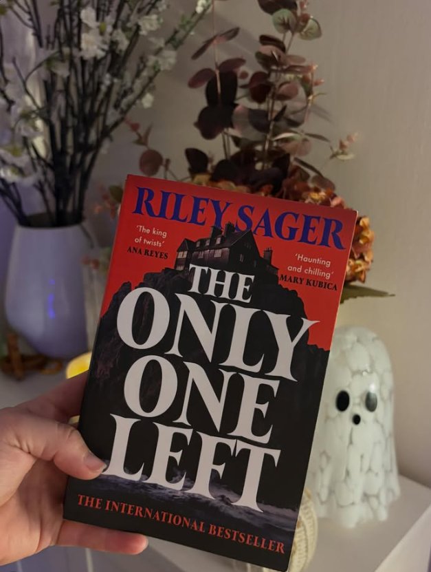 Fliss holding her copy of The Only One Left by Riley Sager